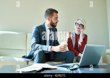 Working Process at Employee Lounge Stock Photo