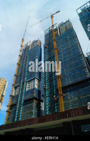 Shenzhen, China: residential buildings under blue sky and white clouds ...
