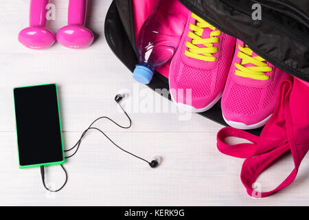 Beautiful sports concept on a gray board from a set for sports in a bag and music for sports Stock Photo