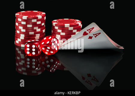 good combination of aces and dice in poker on a black background Stock Photo