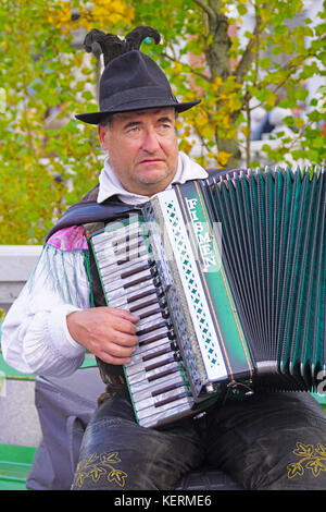 Accordion busker playing in Preseren Square in center of Old Town Ljubljana, Slovenia. Stock Photo