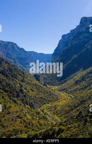 Vikos gorge in greece in autumn, mountains, blue sky, trees Stock Photo