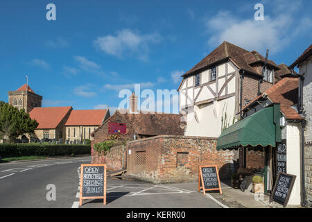 Church, cottages and butcher's shop in Chiddingfold village in Surrey, UK Stock Photo