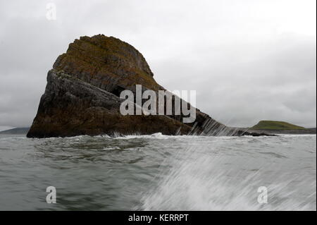 rounding the stack at Worms head Rhossili Stock Photo