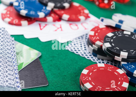 winning combinations of cards on a green poker table, bank cards to pay for victory Stock Photo