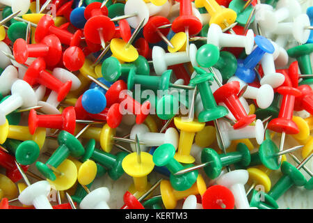 A pile of colorful thumb tacks or push pins Stock Photo