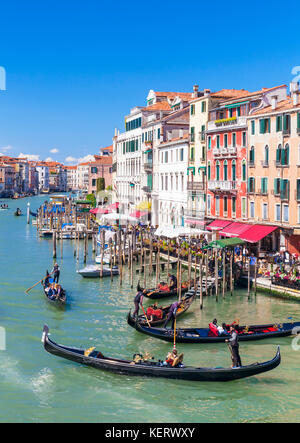 VENICE ITALY VENICE Gondolier rowing a gondola full of tourists on a gondola ride on the grand canal Venice Italy eu europe Stock Photo