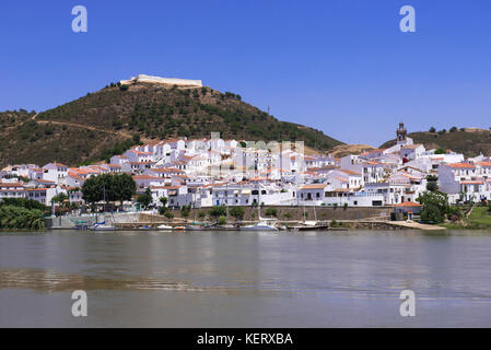 Small Spanish town of Sanlúcar de Guadiana from across the Guadiana river in Alcoutim Portugal Stock Photo