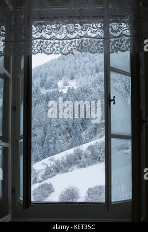 View from an old window into a snowy landscape Stock Photo