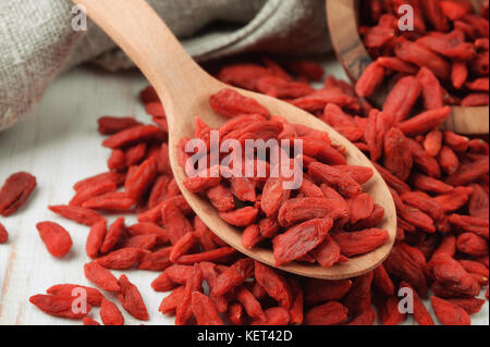 Close up of wood spoon with dried goji berries Stock Photo
