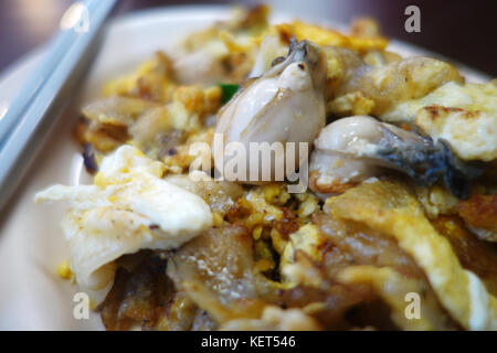 Yummy Southeast Asian fried baby oyster omelette Stock Photo