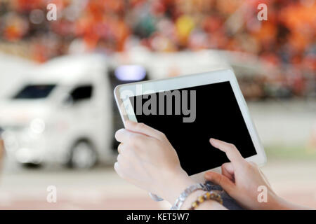 close up asia women using tablet and doctor using touch pad on ambulance car background Stock Photo