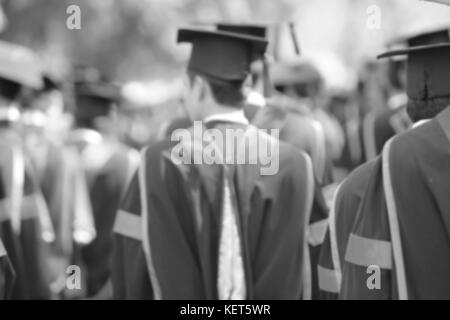 blurry of Graduates are walking the line to get a diploma and selective focus. Stock Photo