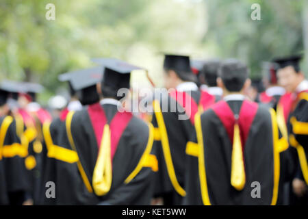 blurry of Graduates are walking the line to get a diploma and selective focus. Stock Photo