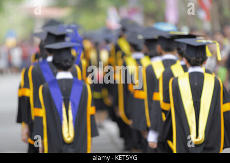 blurry of Graduates are walking the line to get a diploma and selective focus. Stock Photo