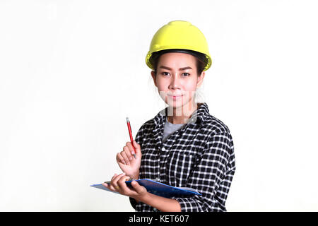 Asian women engineers and technicians are checking the list on the board Stock Photo