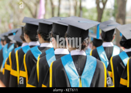 blurry of Graduates are walking the line to get a diploma and selective focus. Stock Photo