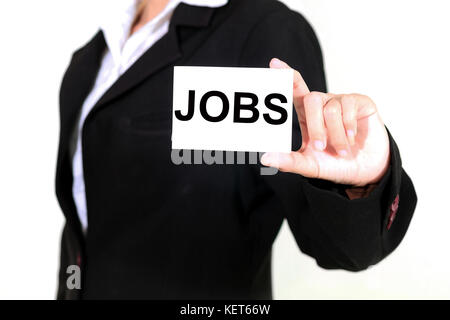 businesswoman asia holding and shown a JOBS word on the business card on white background Stock Photo