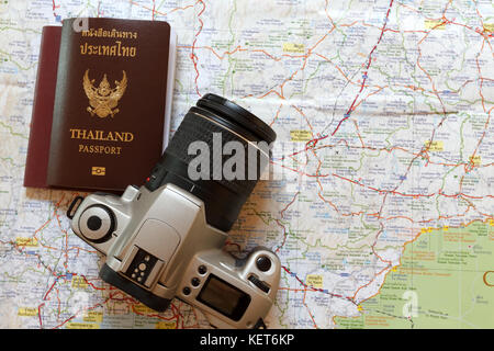 Thailand passport and camera on the map for World travel and travel asia Stock Photo
