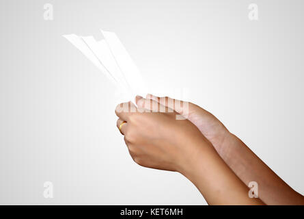 hand of woman asia checking a bill and a long receipt ,soft focus and selective focus on hand Stock Photo