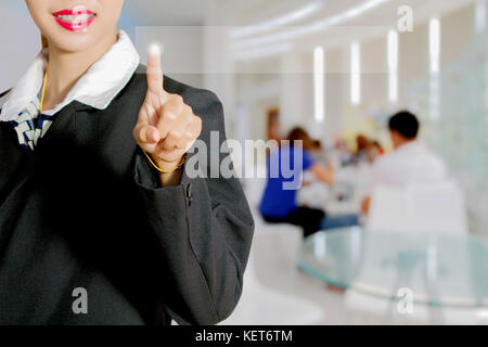 Asian Businesswomen holding hand and touching on virtual screen on people Business background Stock Photo