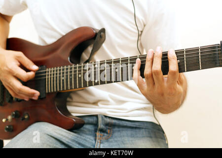 Handsome young asian men playing guitar Stock Photo