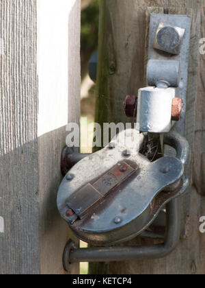 locked metal padlock on gate outside country closed; essex; england; uk Stock Photo