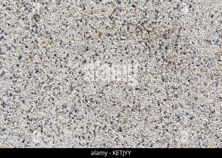 Small gravel wall Mix with white, black gray stone to make a wall or floor in the building. Houses Used as a background. copy space. Stock Photo