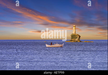 The venetian lighthouse at the Chora (Hora) of Andros island, Cyclades, Greece Stock Photo