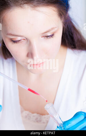 Female laboratory technician To do blood test in medical laboratory Stock Photo