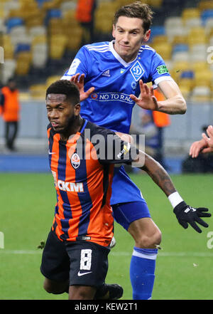Kiev, Ukraine. 22nd October, 2017. Denys Garmash of FC Dynamo Kyiv (in Blue) fights for a ball with Fred of FC Shakhtar Donetsk during their Ukrainian Premier League game at NSC Olympic stadium in Kyiv, Ukraine. Credit: Oleksandr Prykhodko/Alamy Live News Stock Photo