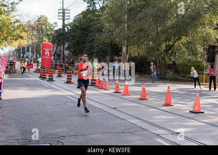 Toronto, Canada. 22nd Oct, 2017. Canadian marathon runner Baghdad Rachem passing the 33km turnaround point at the 2017 Scotiabank Toronto Waterfront Marathon. He achieves the eighteenth place in the race. Credit: YL Images/Alamy Live News Stock Photo