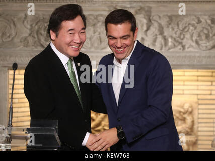 Seoul, South Korea. 24th Oct, 2017. PM in Greece South Korean Prime Minister Lee Nak-yeon (L) shakes hands with his Greek counterpart Alexis Tsipras after their meeting in Athens on Oct. 23, 2017. Lee is in Greece to attend an Olympic flame lighting ceremony for the 2018 Winter Olympics in the South Korean alpine town of PyeongChang the next day. Credit: Yonhap/Newcom/Alamy Live News