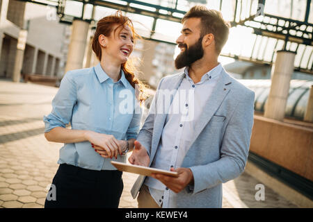 Business colleagues talking on break from work Stock Photo
