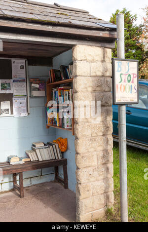 Bus Stop Books (to beg, borrow or exchange) in a bus stop on the Brecon Beacons at Felindre, Powys, Wales UK Stock Photo