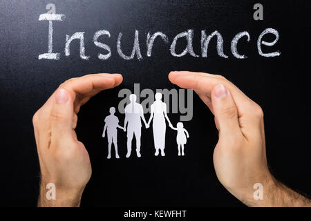 Photo Of Insurance Of Family Concept On Blackboard Stock Photo