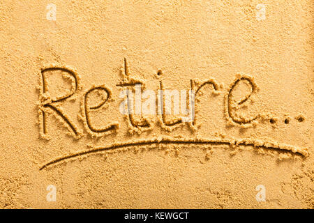 High Angle View Of A Retirement Concept Written On Sandy Beach Stock Photo
