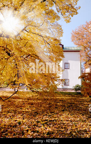Holy Trinity Church stands in ancient botanical garden in Kiev, Ukraine. One of the most popular tourists places in Kiyv. Autumn garden landscape background Stock Photo