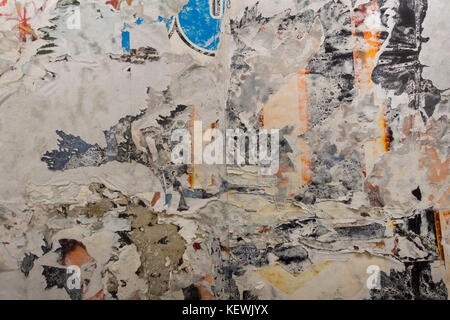 torn poster on a wall NYC Stock Photo