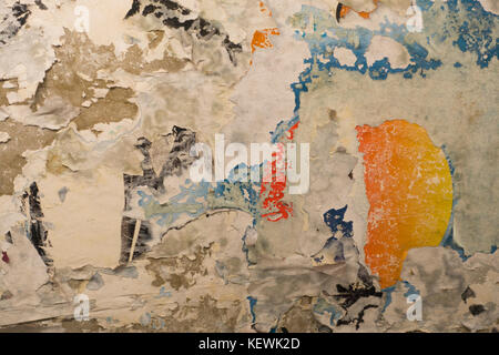 torn poster on a wall NYC Stock Photo