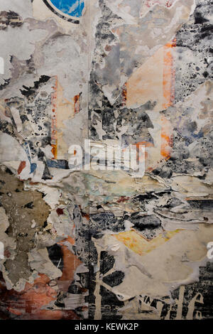 torn poster on a wall NYC Stock Photo