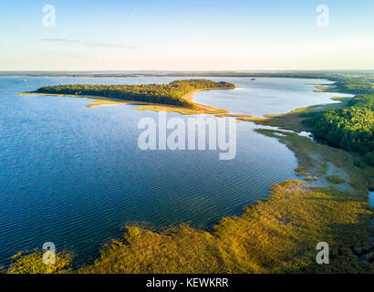 Beautiful aerial view of Upałty island by the sunset in Mamerki, Mazury district lake, Poland