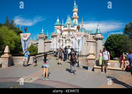 ANAHEIM, CA - OCTOBER 16, 2017: Guests walk through the landmark castle at Disneyland Theme Park Resort in California. Stock Photo