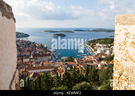 The idyllic Adriatic town of Hvar where impressive Venetian-era houses proudly line the broad waterfront and bay. Stock Photo