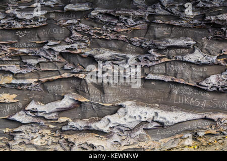 Grafiti carved into a rock cliff in Sydney Stock Photo