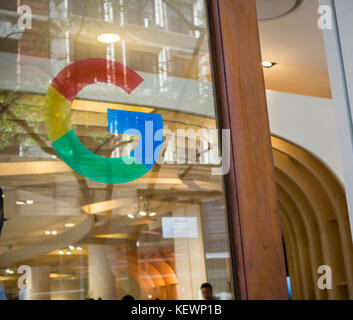 The Google logo on the door of the Google store in the Flatiron neighborhood of New York on its grand opening day, Thursday, October 19, 2017. The store displays a variety of products from Google besides the new Pixel smartphones and as a first for Google excited consumers will be able to purchase their Google products at the store as opposed to the pop-up being just a showroom. (© Richard B. Levine) Stock Photo