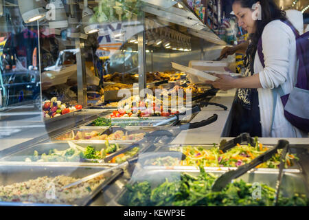 Lunchers fill their containers at a salad bar/ buffet in a delicatessen in New York on Friday, October 20, 2017. (© Richard B. Levine) Stock Photo