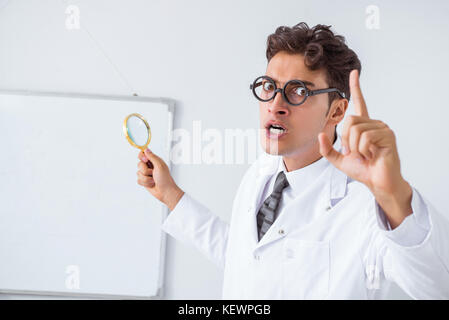 Funny doctor scientist making presentation in hospital Stock Photo