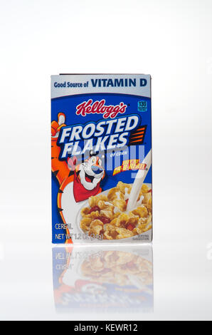 Unopened box of Kelloggs breakfast cereal Frosted Flakes on white background cut out USA. Stock Photo