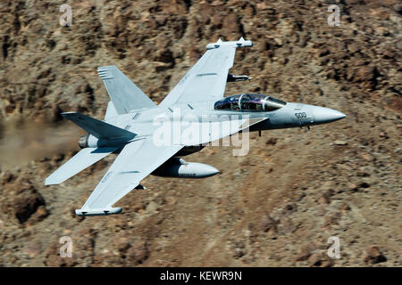 Boeing EA-18G Growler from the United States Navy VX-9 Vampires squadron (XE-500) flies low level through the Jedi Transition, Star Wars Canyon, Death Valley National Park, California, United States of America Stock Photo